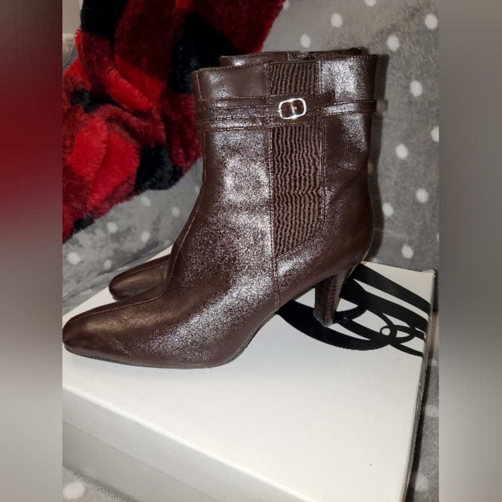 Gently loved Nine West high heeled ankle boots, with accent buckle